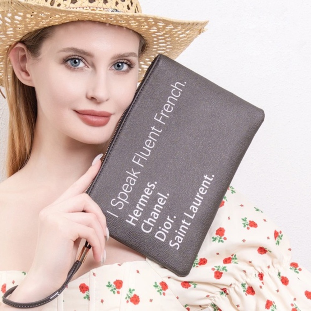 I speak fluent French black wristlet clutch bag Dior Chanel, Hermes
